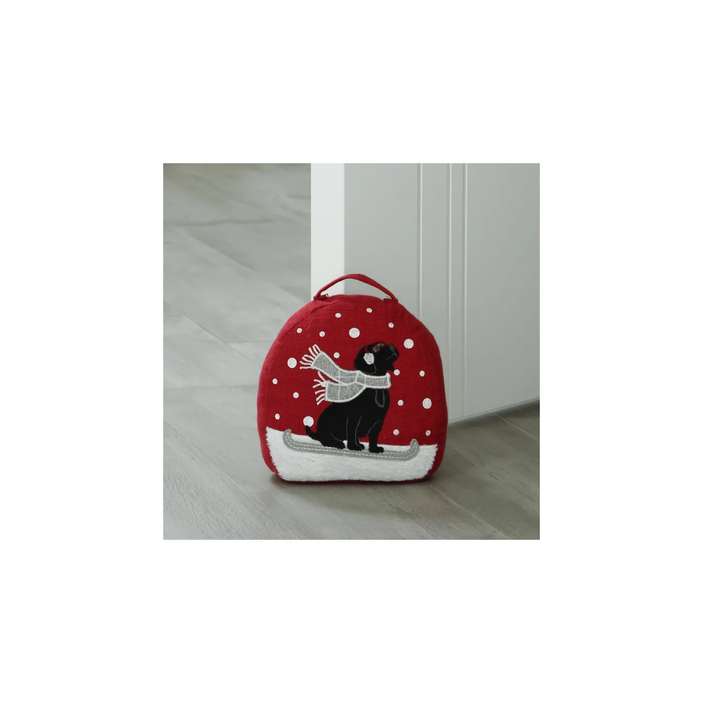 Dog with Snow Red Door Stopper